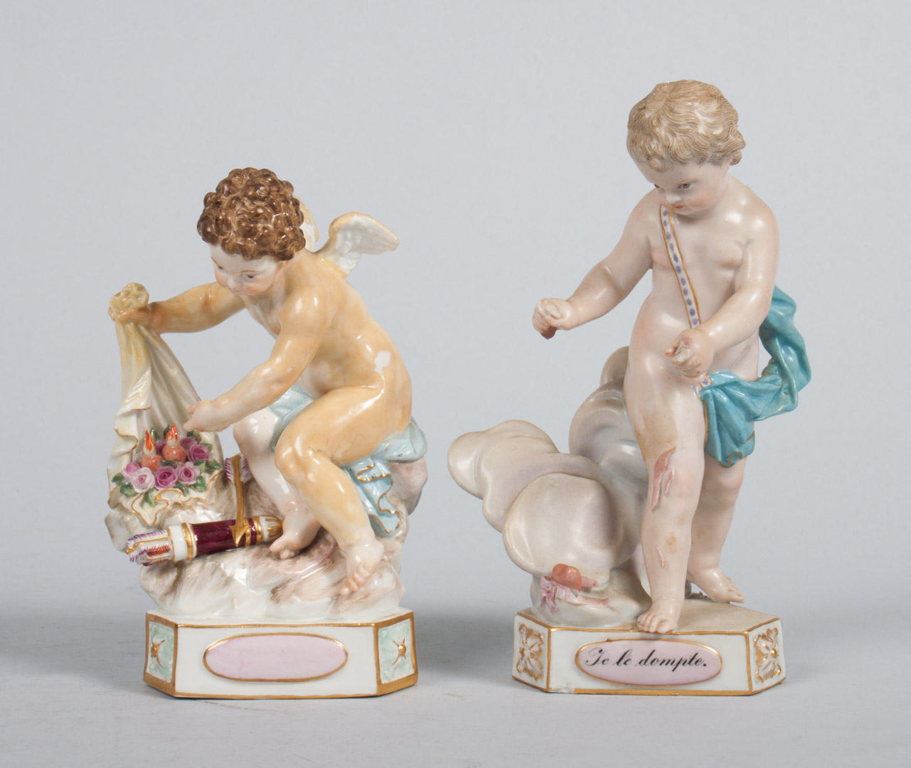 Appraisal: Two Meissen porcelain cupid figures each modeled as God of