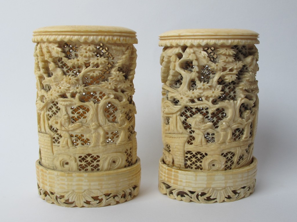 Appraisal: A pair of Chinese export carved ivory tusk vases pierced