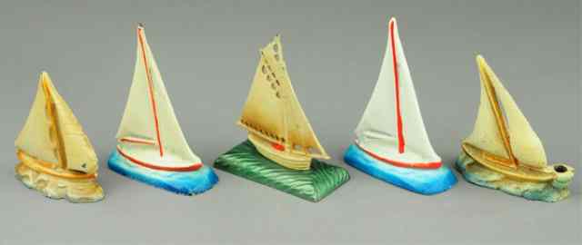 Appraisal: SAILBOAT GROUPING PAPERWEIGHTS Cast iron each depicted in full open