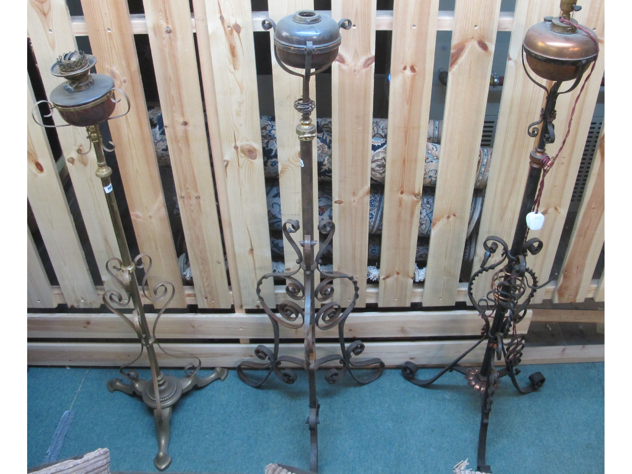 Appraisal: Three early th Century floor standing paraffin lamps