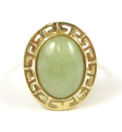 Appraisal: JADE AND FOURTEEN KARAT GOLD RING set with an oval