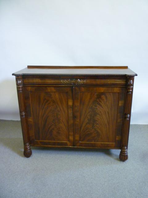 Appraisal: A REGENCY ROSEWOOD SIDE CABINET the beaded edged top with