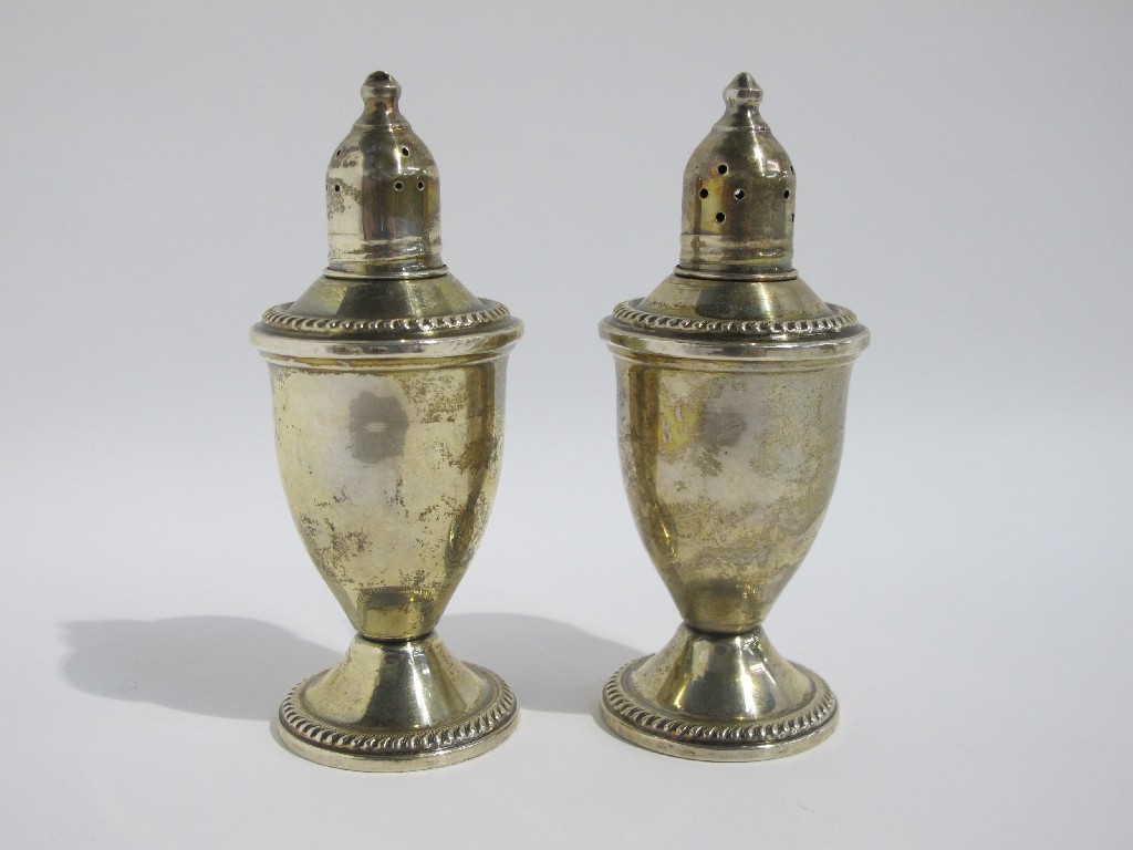 Appraisal: A pair of sterling silver pepperettes