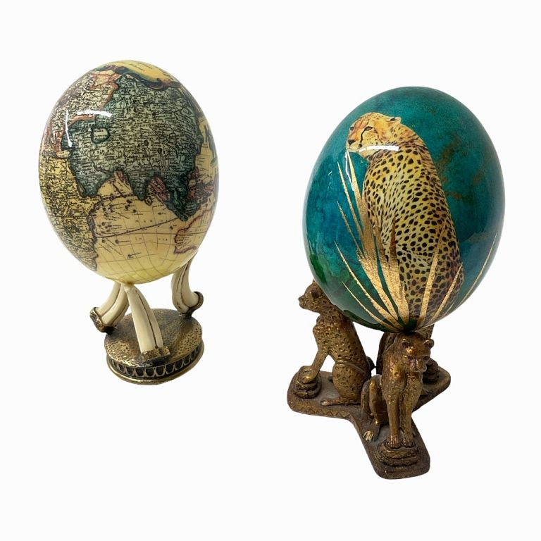 Appraisal: Pair of Glazed Ostrich Eggs With decorated bases The egg