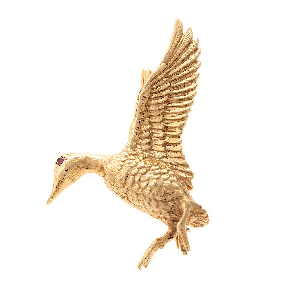 Appraisal: An Oscar Caplan Duck Brooch with Ruby Eye in K