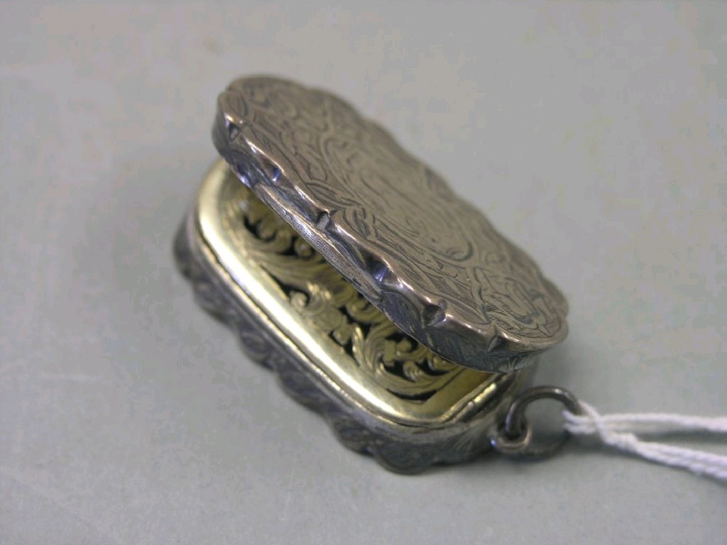 Appraisal: A Victorian engraved silver vinaigrette central reserve personalised interior cover