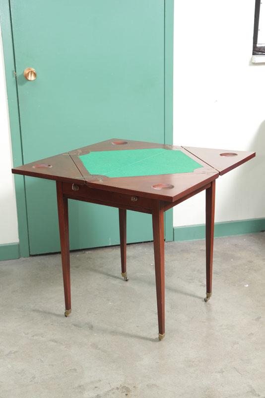 Appraisal: GAME TABLE Mahogany having a swivel top with four hinged