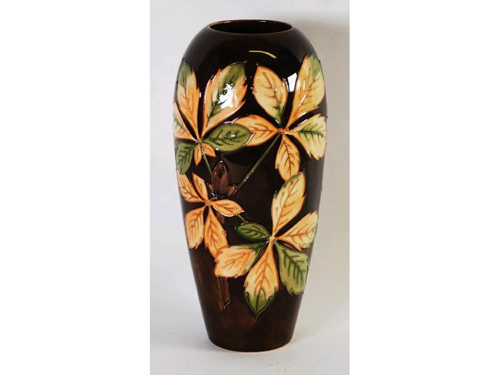 Appraisal: WALTER MOORCROFT CHESTNUT LEAF PATTERN TUBE LINED POTTERY VASE slender