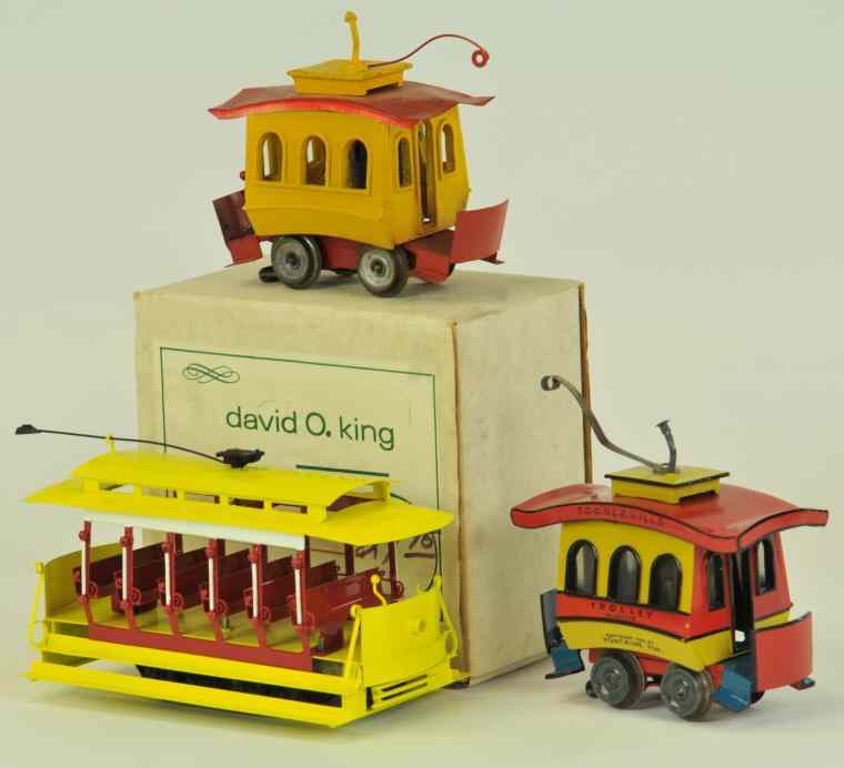 Appraisal: DAVID O KING TOONERVILLE TROLLEY EXAMPLES Die-cast bodies very colorful