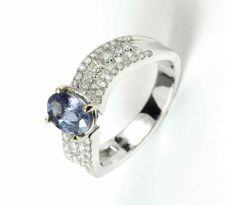 Appraisal: NATURAL ALEXANDRITE AND DIAMOND RING k white gold with round-cut