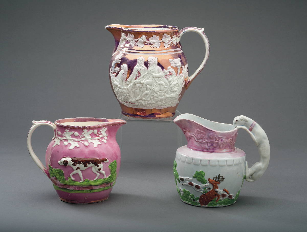 Appraisal: TWO STAFFORDSHIRE PINK LUSTRE AND ENAMEL-DECORATED SPORTING JUGS AND A