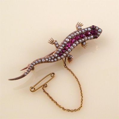 Appraisal: An Edwardian ruby and half pearl set lizard brooch set