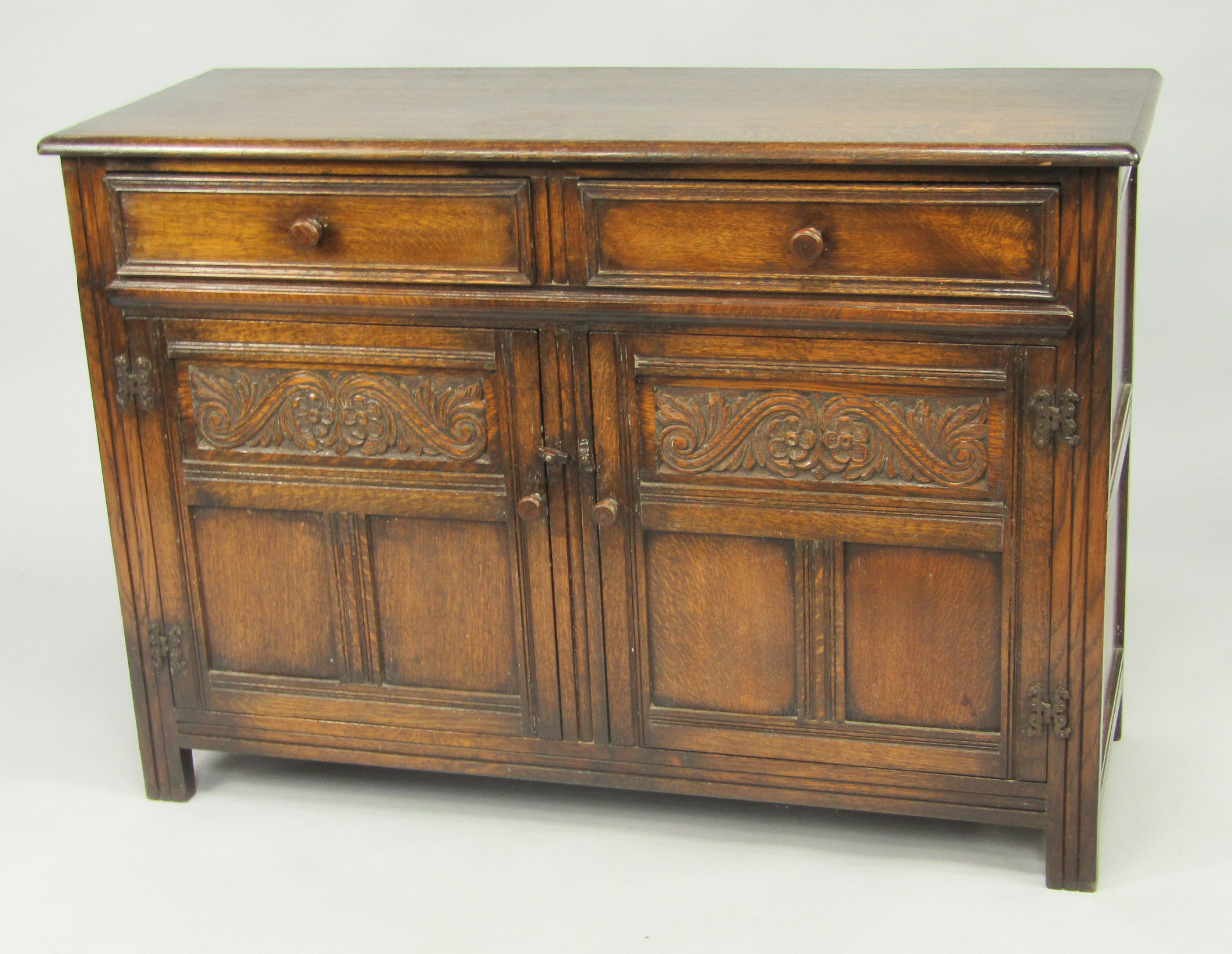 Appraisal: A thC oak sideboard with a pair of drawers above