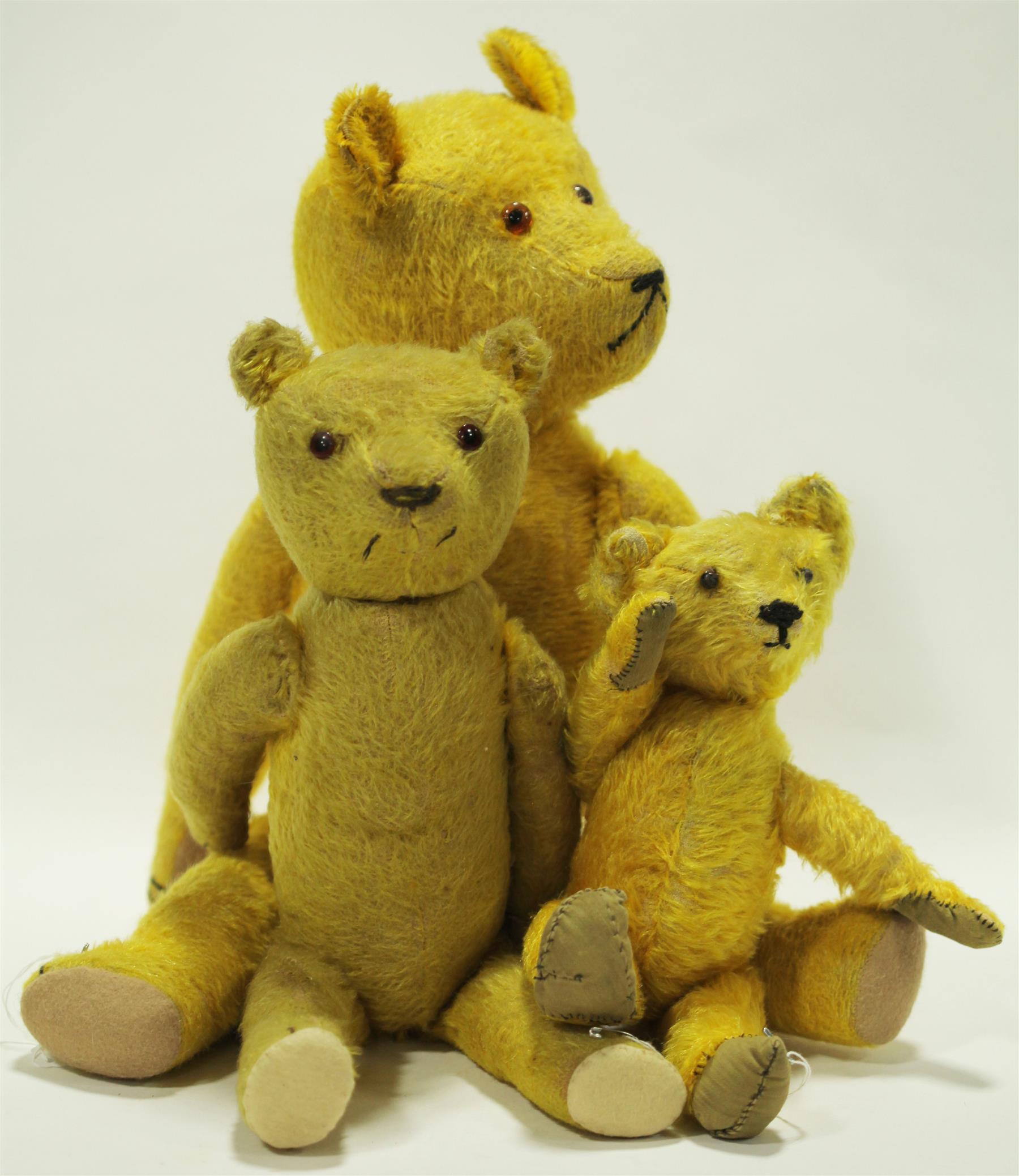 Appraisal: FAMILY OF THREE GOLDEN MOHAIR BEARS American or German early