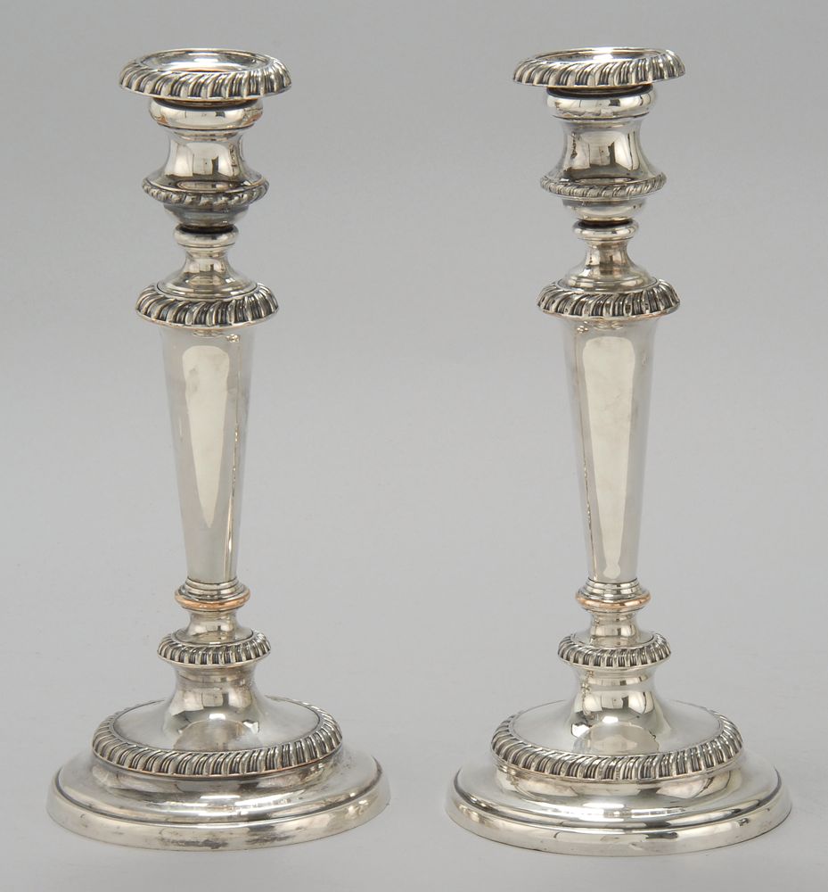 Appraisal: PAIR OF ANTIQUE SHEFFIELD PLATED CANDLESTICKS In circular form with