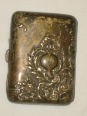 Appraisal: A VICTORIAN CIGARETTE CASE of curved oblong form with monogrammed