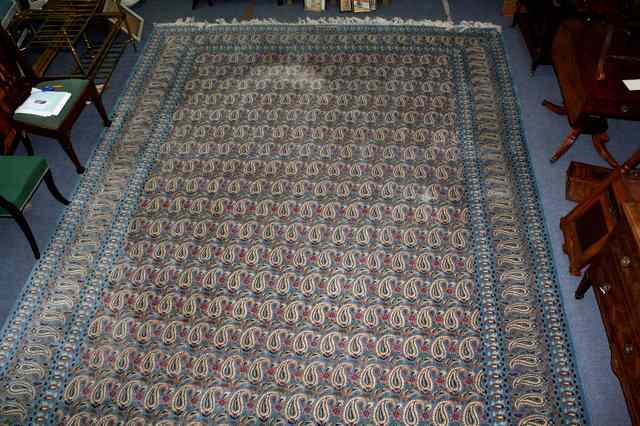 Appraisal: A PERSIAN BLUE GROUND LARGE CARPET decorated a continuing pattern