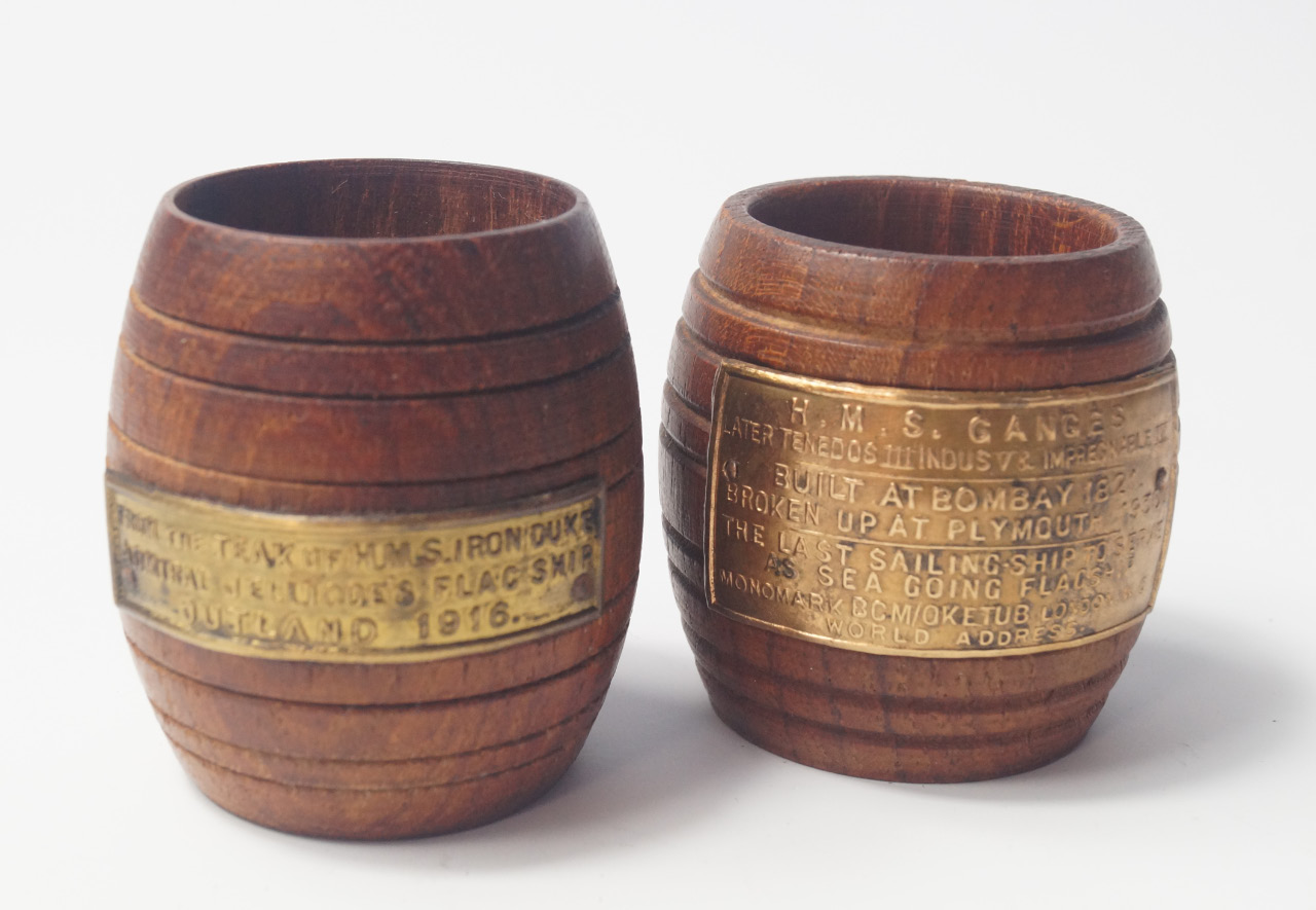 Appraisal: Two teak barrels from HMS Iron Duke Admiral Jellicoe's Flag