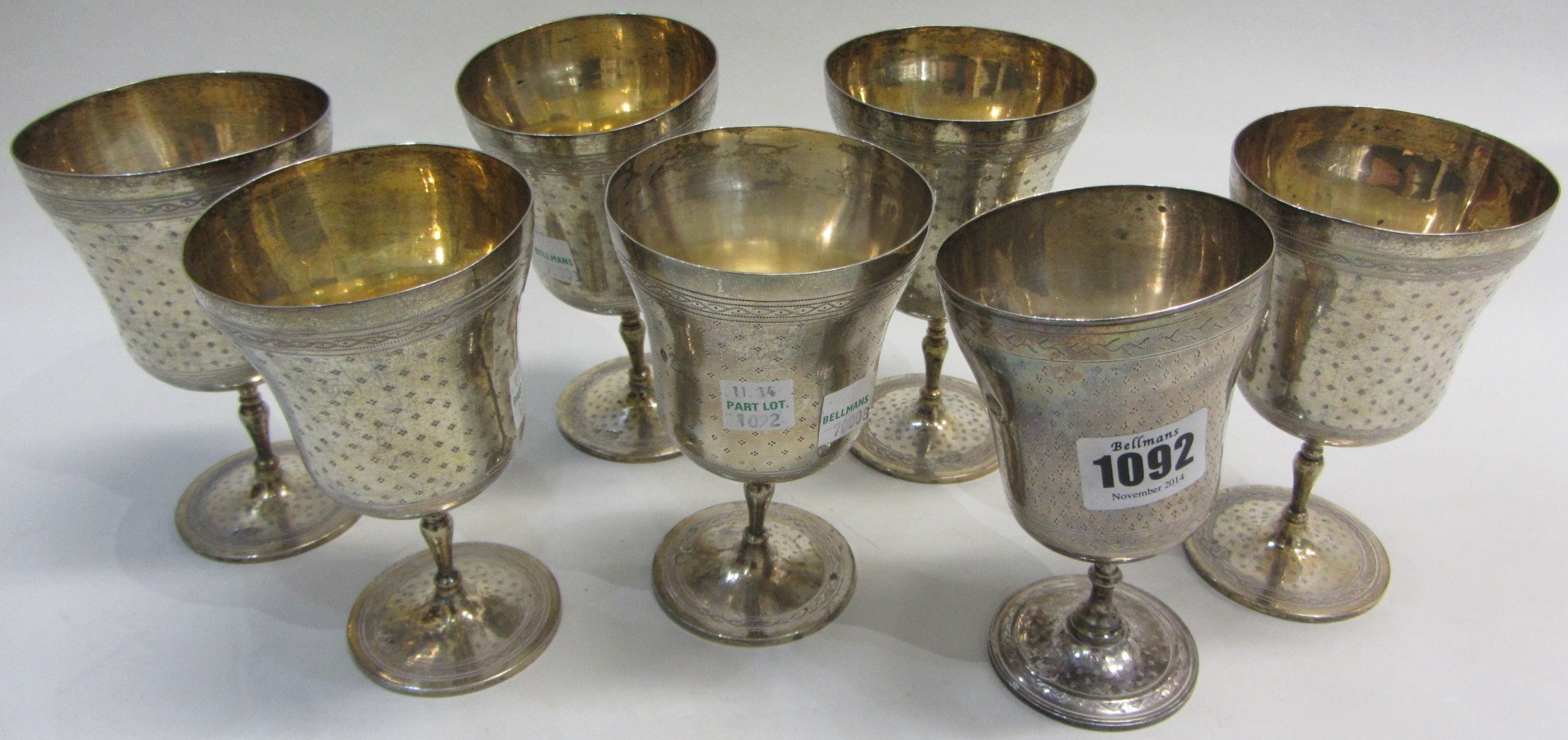 Appraisal: Seven Eastern wine goblets with engraved patterned decoration each on