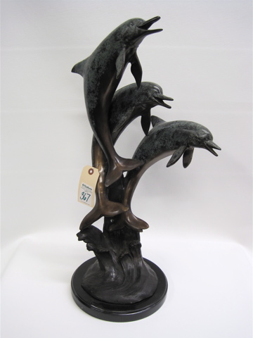 Appraisal: BRONZE SCULPTURE depicting three playful dolphins leaping out of the