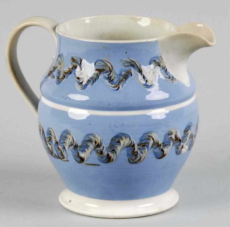 Appraisal: Mocha Pottery Pitcher Description Beautiful blue color with decorative wavy