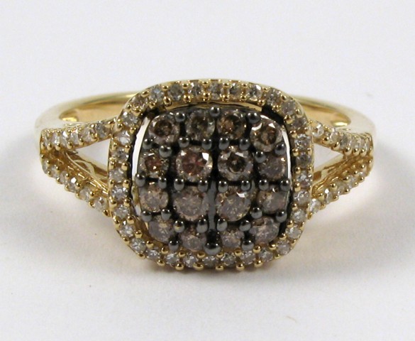 Appraisal: CHAMPAGNE DIAMOND AND FOURTEEN KARAT GOLD RING set with round-cut