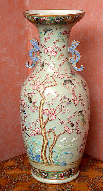 Appraisal: A CHINESE CELADON GROUND BALUSTER VASE decorated with flowering prunus