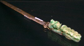 Appraisal: A Chinese silvered brass letter opener with carved jade handle