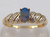 Appraisal: A carat gold opal and diamond ring opal approx x