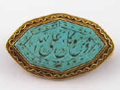 Appraisal: A yellow metal tests carat gold turquoise brooch with locket