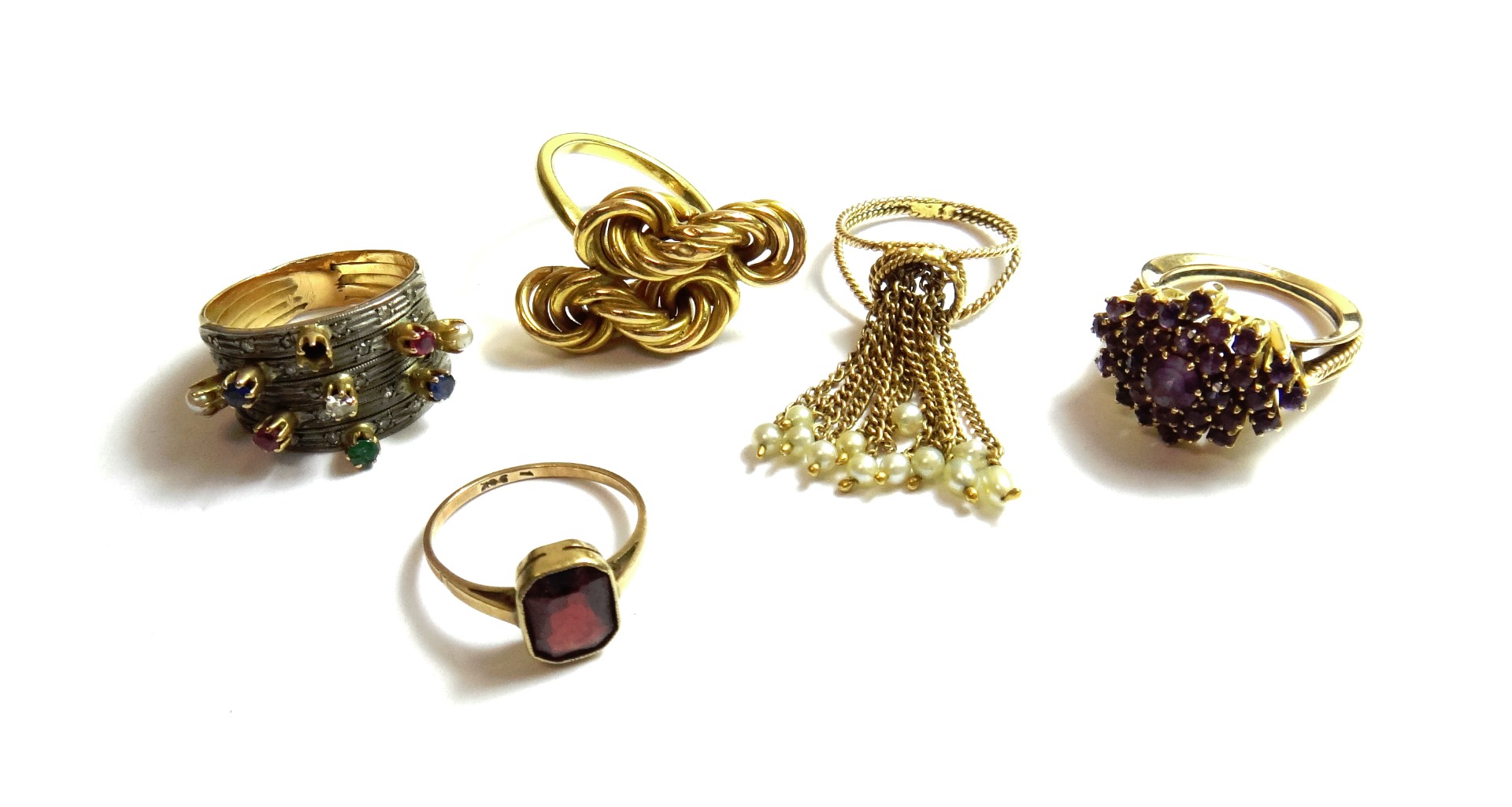 Appraisal: A gold ring in an interwoven wirework design a gold