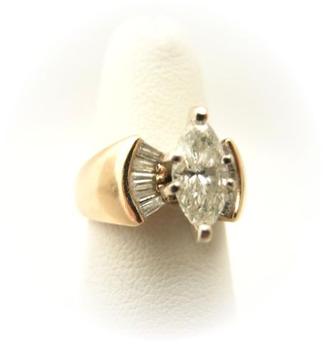 Appraisal: k yellow gold diamond ring with ct marquis center diamond