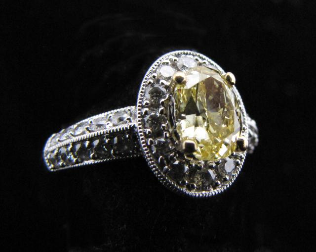 Appraisal: K white gold ring with ct fancy yellow oval diamond