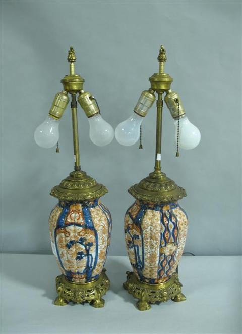 Appraisal: PAIR OF JAPANESE IMARI GILT-BRONZE MOUNTED LAMPS th century the