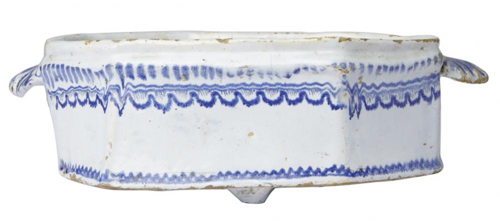 Appraisal: FRENCH FAIENCE NEVERS RECTANGULAR DEEP SIDED DISH WITH SHELL HANDLES