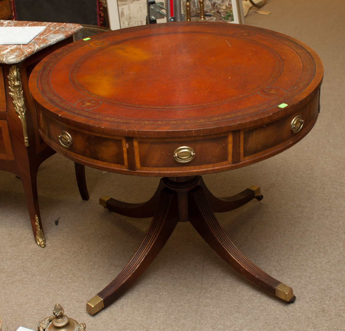 Appraisal: a George III style mahogany drum table in round tooled