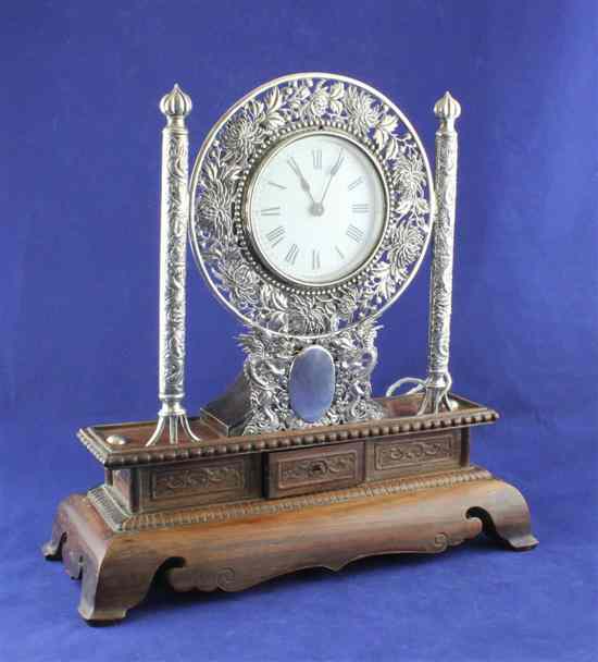 Appraisal: An early th century Chinese silver mounted hardwood mantel timepiece