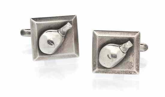 Appraisal: A Pair of Silver Golf Motif Cufflinks depicting the head