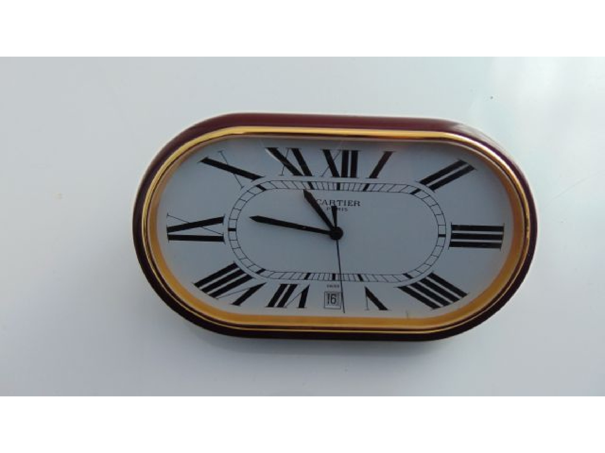 Appraisal: A Les Must de Cartier desk clock the dial marked