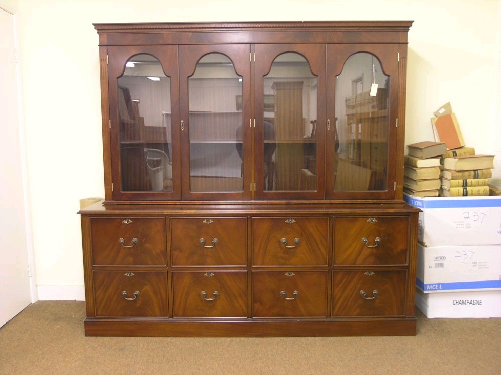 Appraisal: A large reproduction mahogany bookcase upper stage with two pairs