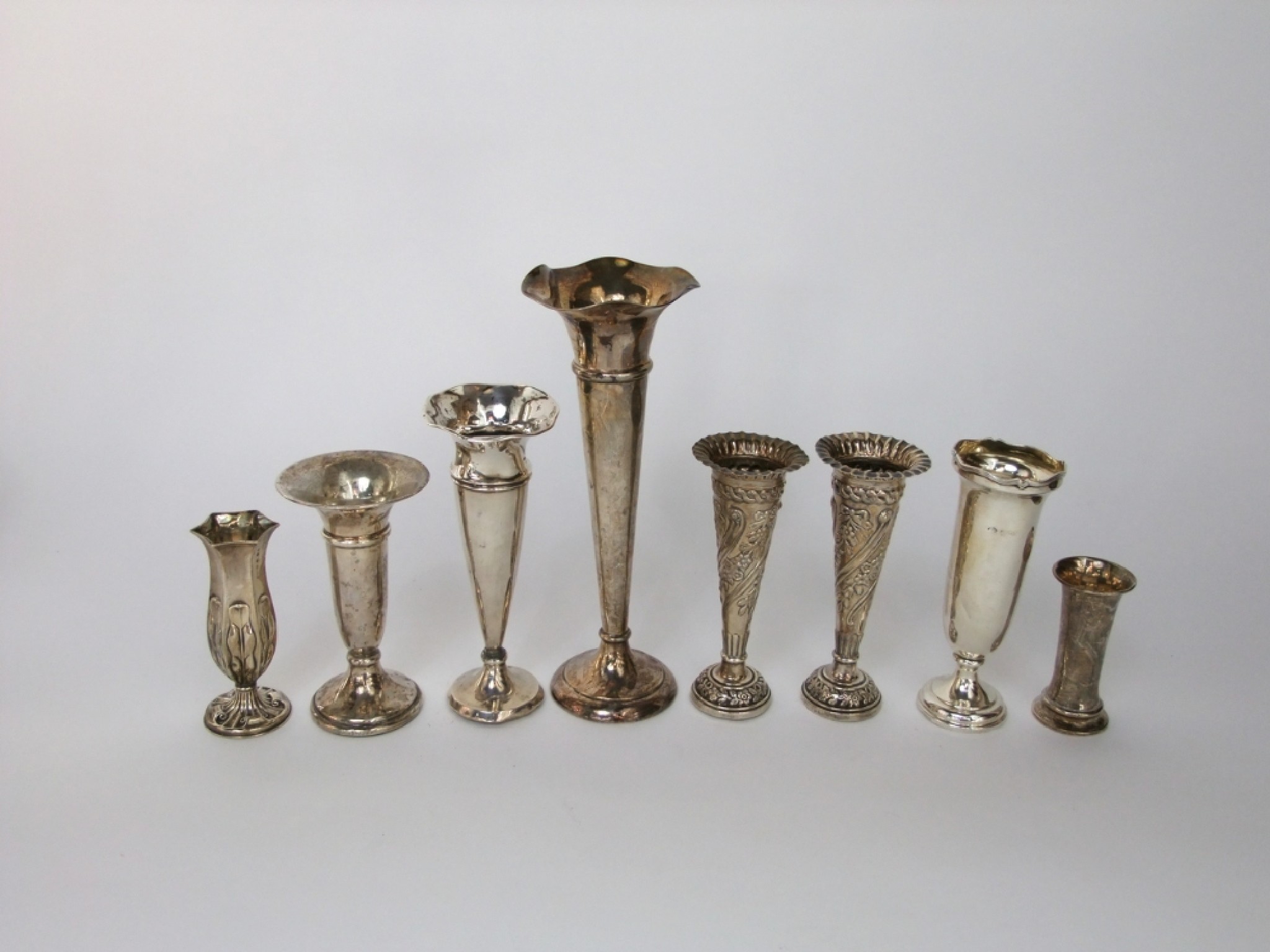 Appraisal: Eight silver trumpet shaped vases in various sizes decoration and