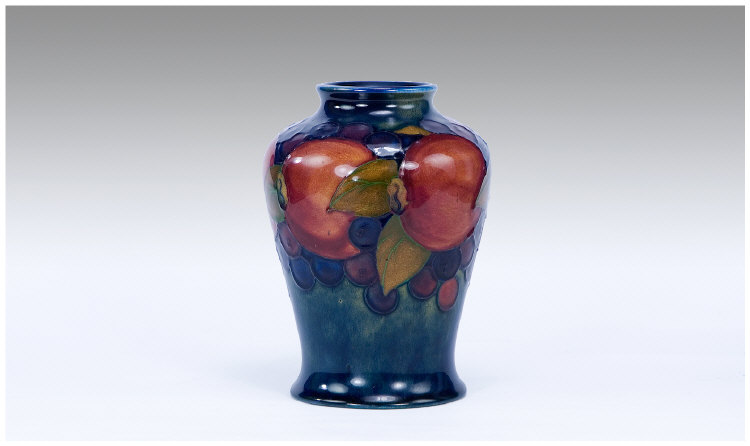 Appraisal: Moorcroft Vase Pomegranate and Berries Design Marks to base Stands