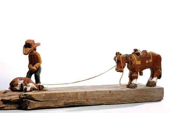 Appraisal: TWO WESTERN SCULPTURES Two contemporary carved wood Western themed sculptures