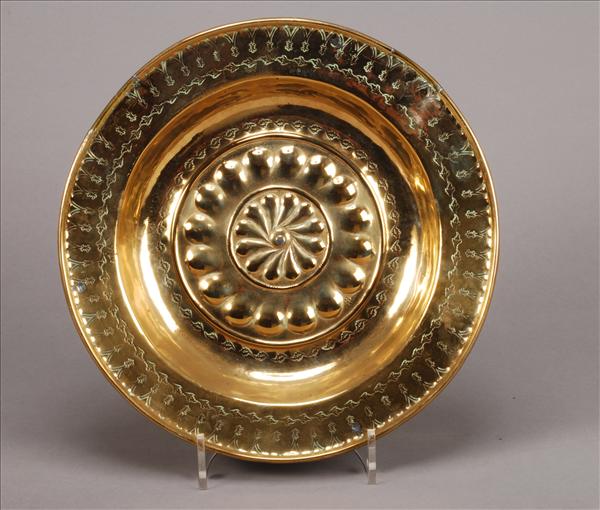 Appraisal: A Nuremberg brass alms dish late th century the centre