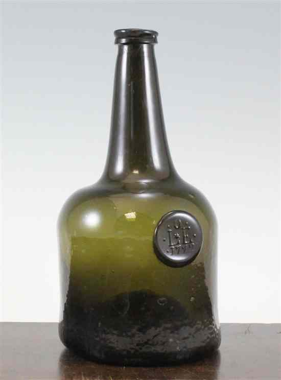 Appraisal: A black glass sealed wine bottle English medium olive coloured