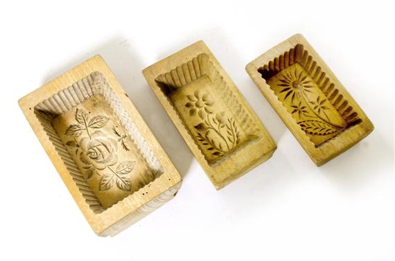 Appraisal: BUTTER MOLDS Alpine Carved wood Rectangular Interior with floral decoration