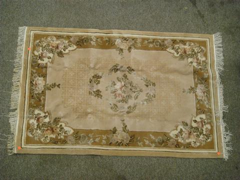 Appraisal: x tan Chinese rug Estimate -