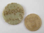 Appraisal: Two finely carved Chinese jade disc pendants largest approx cm