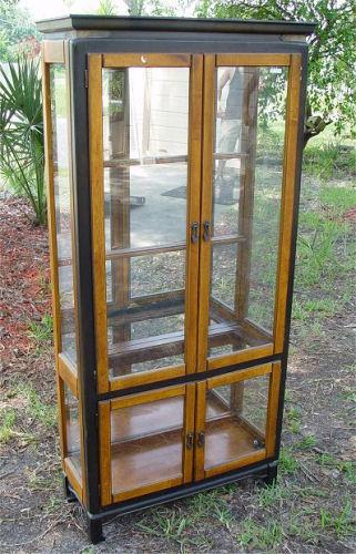 Appraisal: CONTEMPORARY CHINESE STYLE UPRIGHT CURIO DISPLAY CABINET Glass doors and