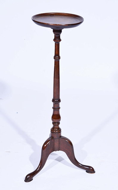 Appraisal: A GEORGIAN STYLE MAHOGANY WINE TABLE with turned support and